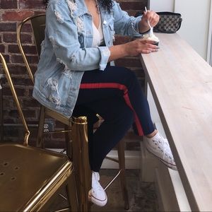 Navy pants with orange side stripe